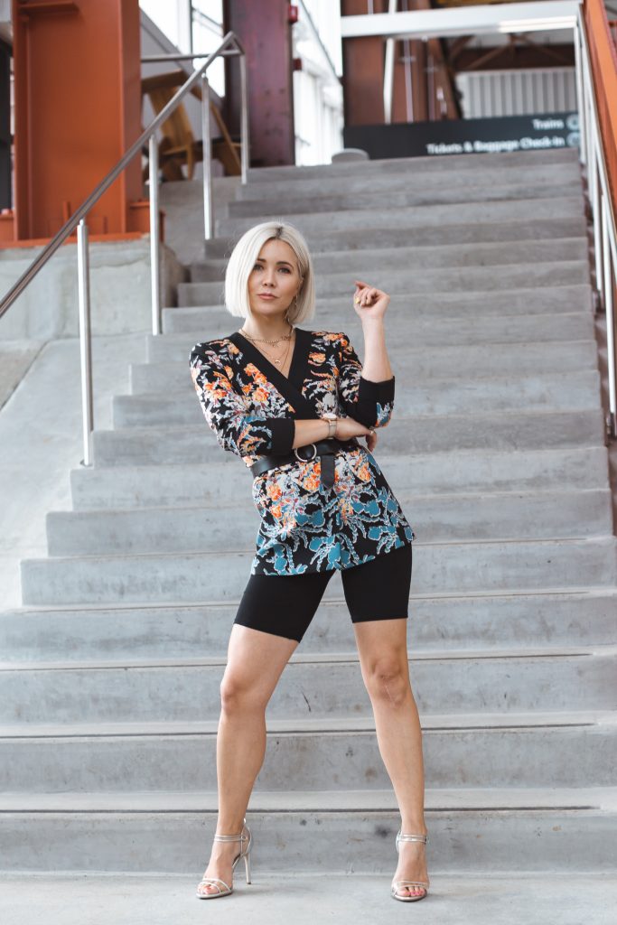 Blonde women standing in front of stairs